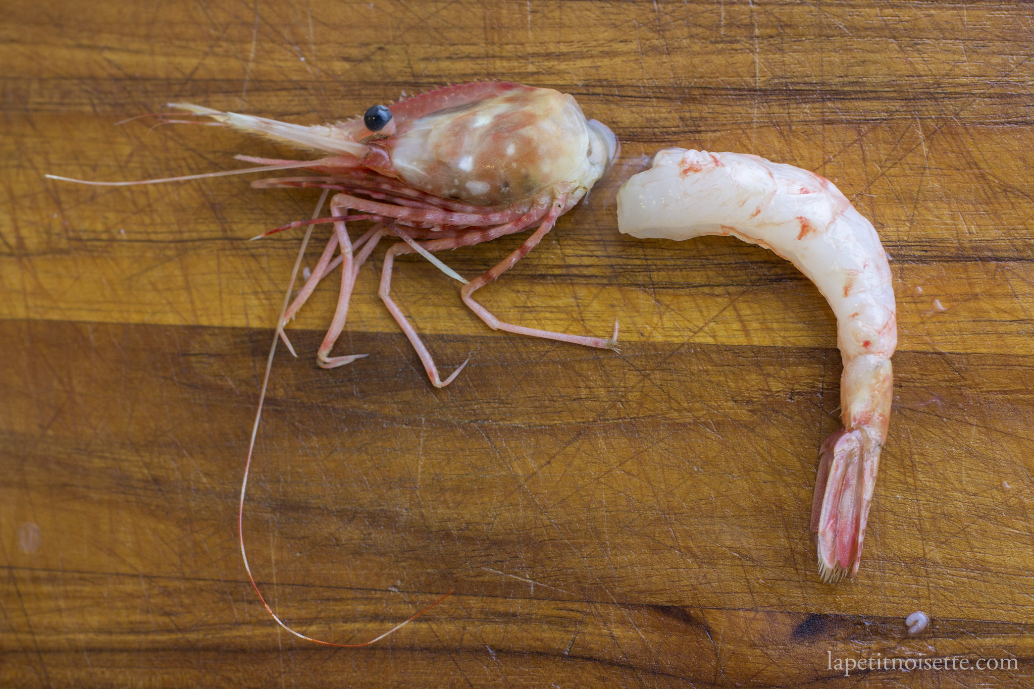 Peeling a botan shrimp.