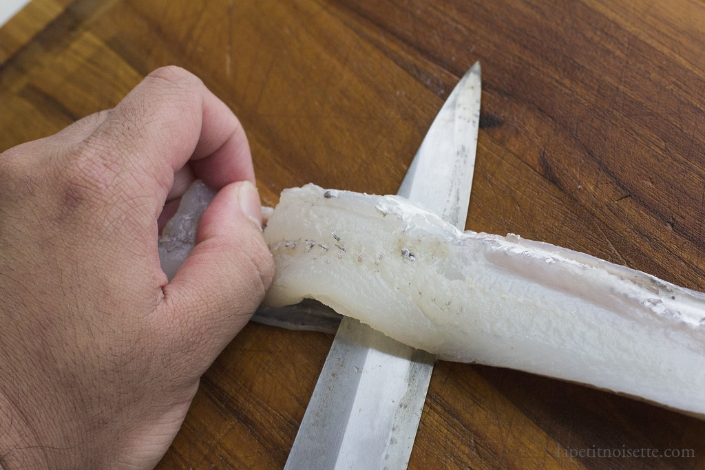 Removing the skin on a yagara fillet for sushi.