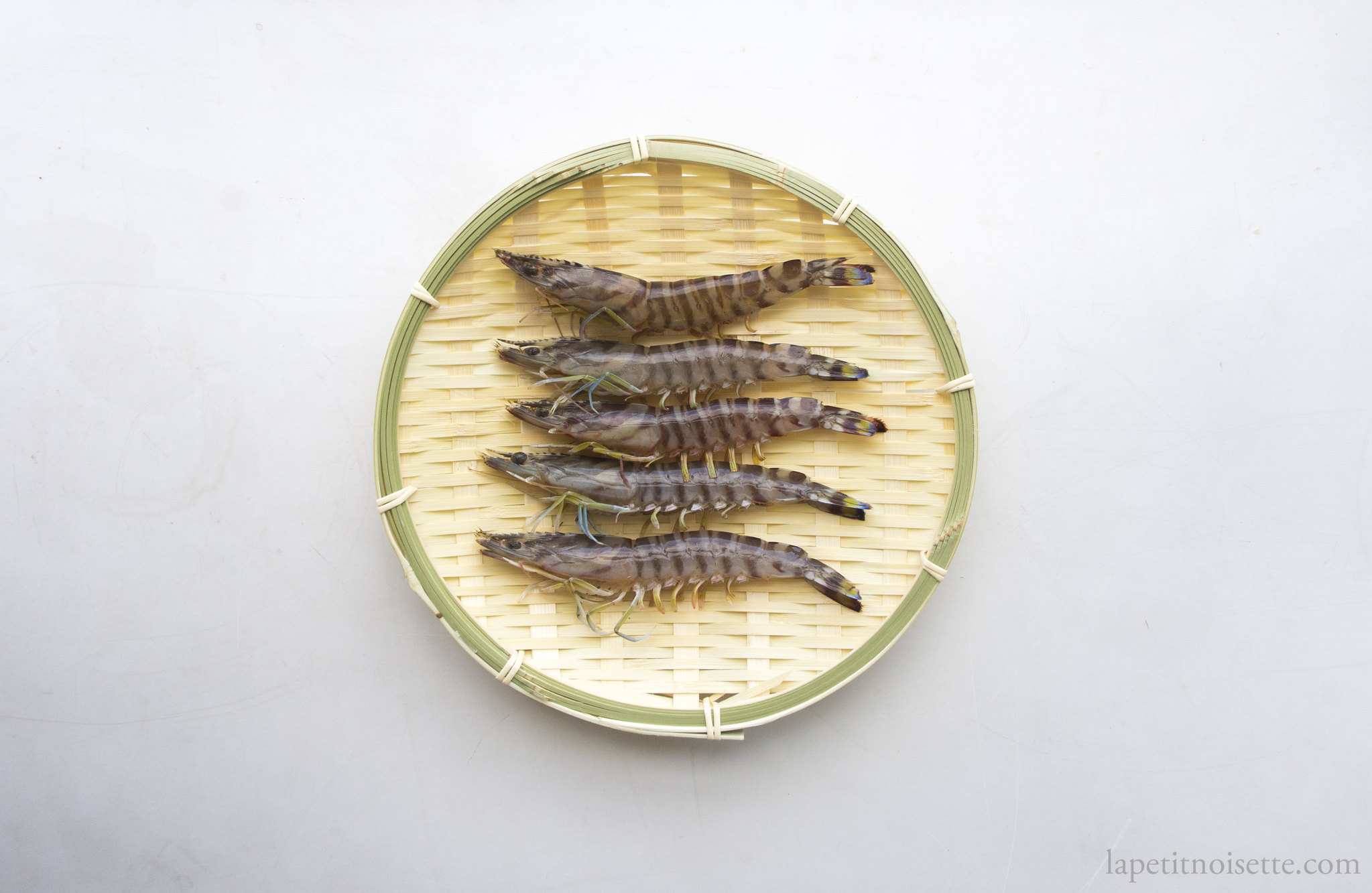 Japanese wheel shrimp on a bamboo colander.