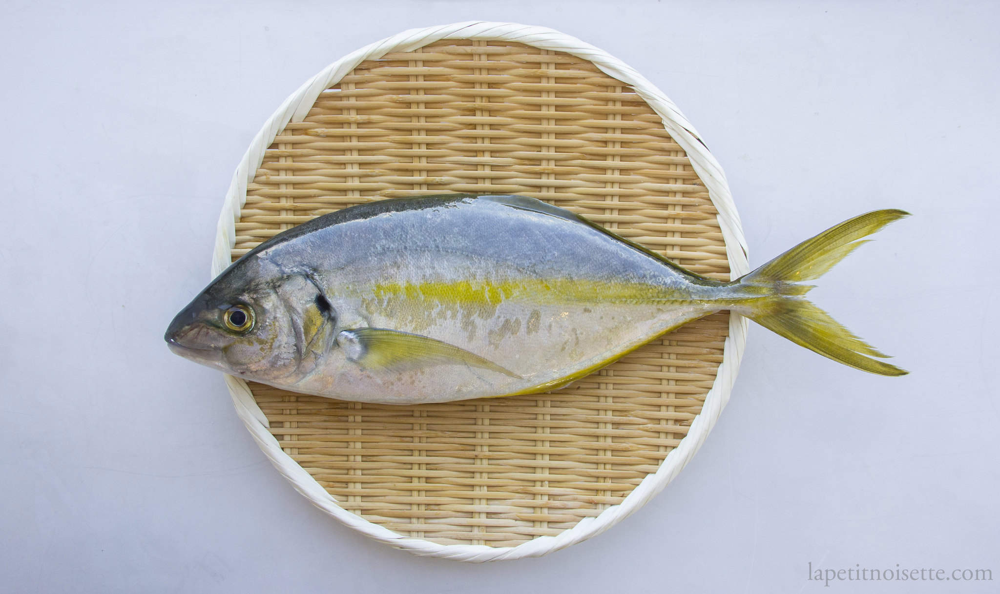 A Japanese Trevally on a bamboo colander.