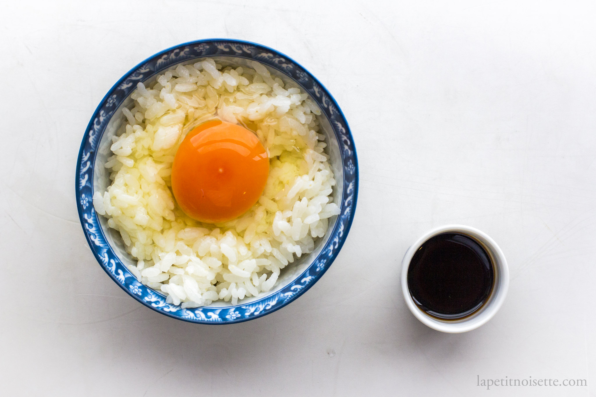 A traditional Japanese meal of raw egg over rice known as tamagokakegohan.