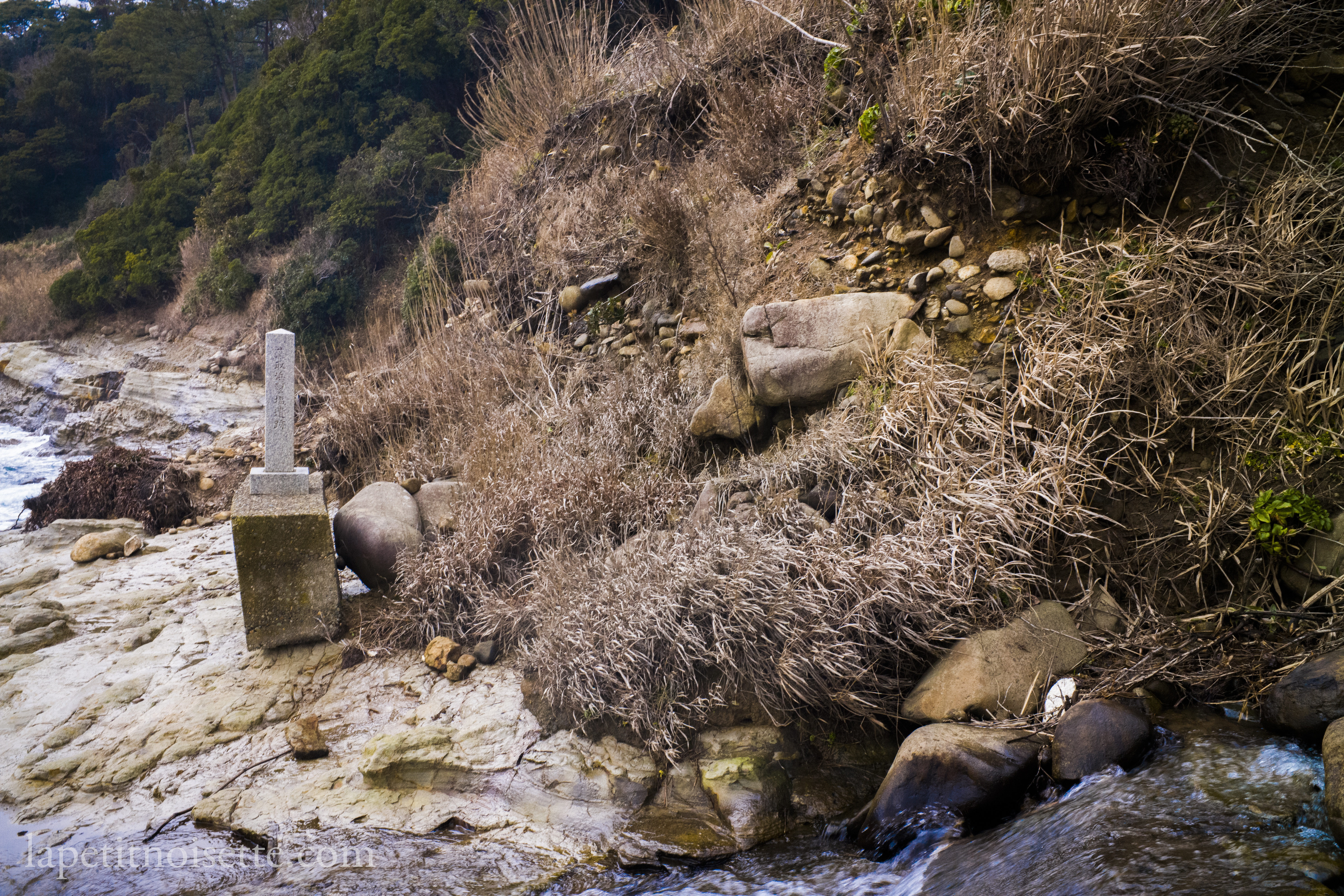 An old salt extraction site near the famous Tojinbo (東尋坊) cliffs denoted by the stone plaque.