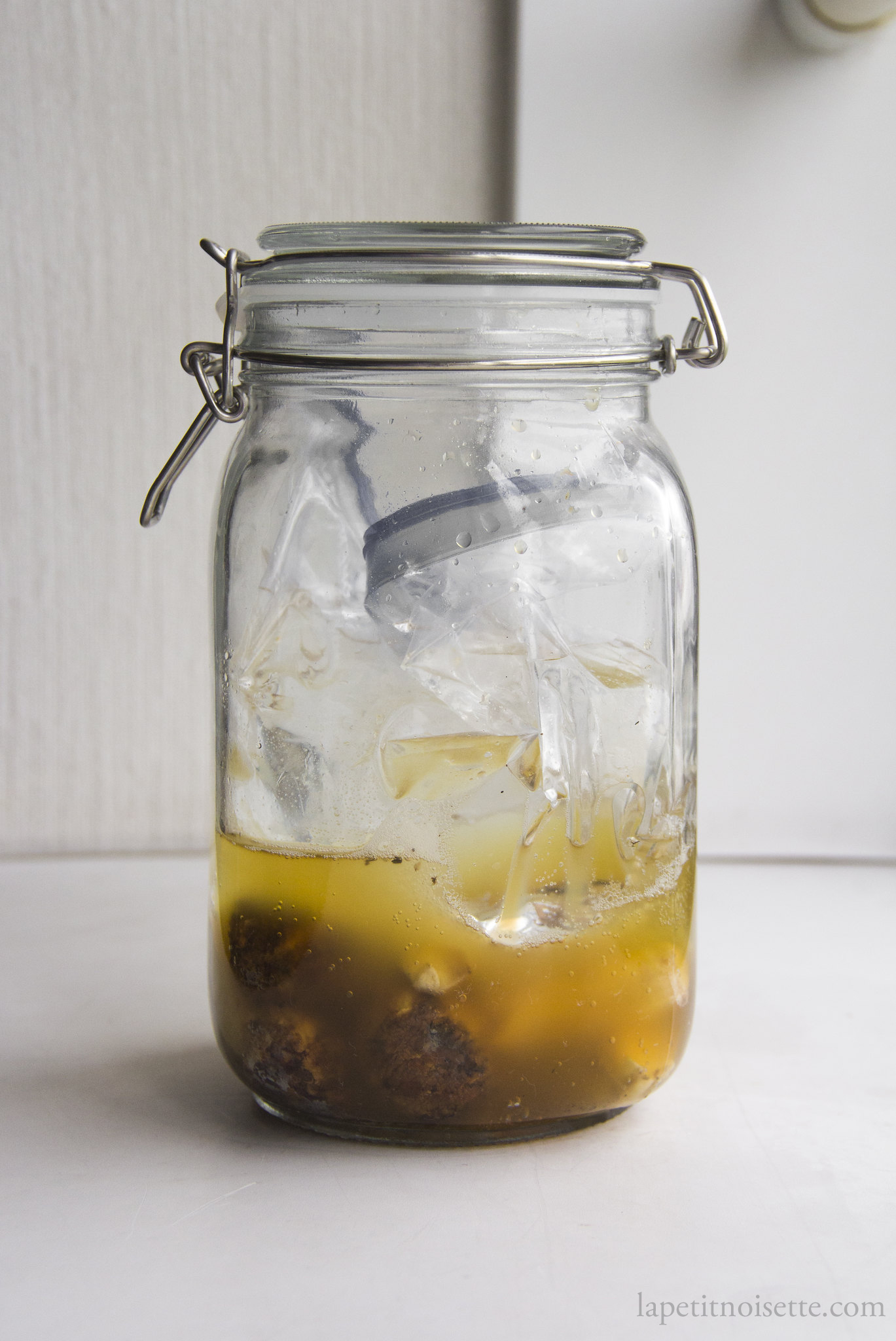A glass jar showing the carbon dioxide released during lactic acid fermentation.