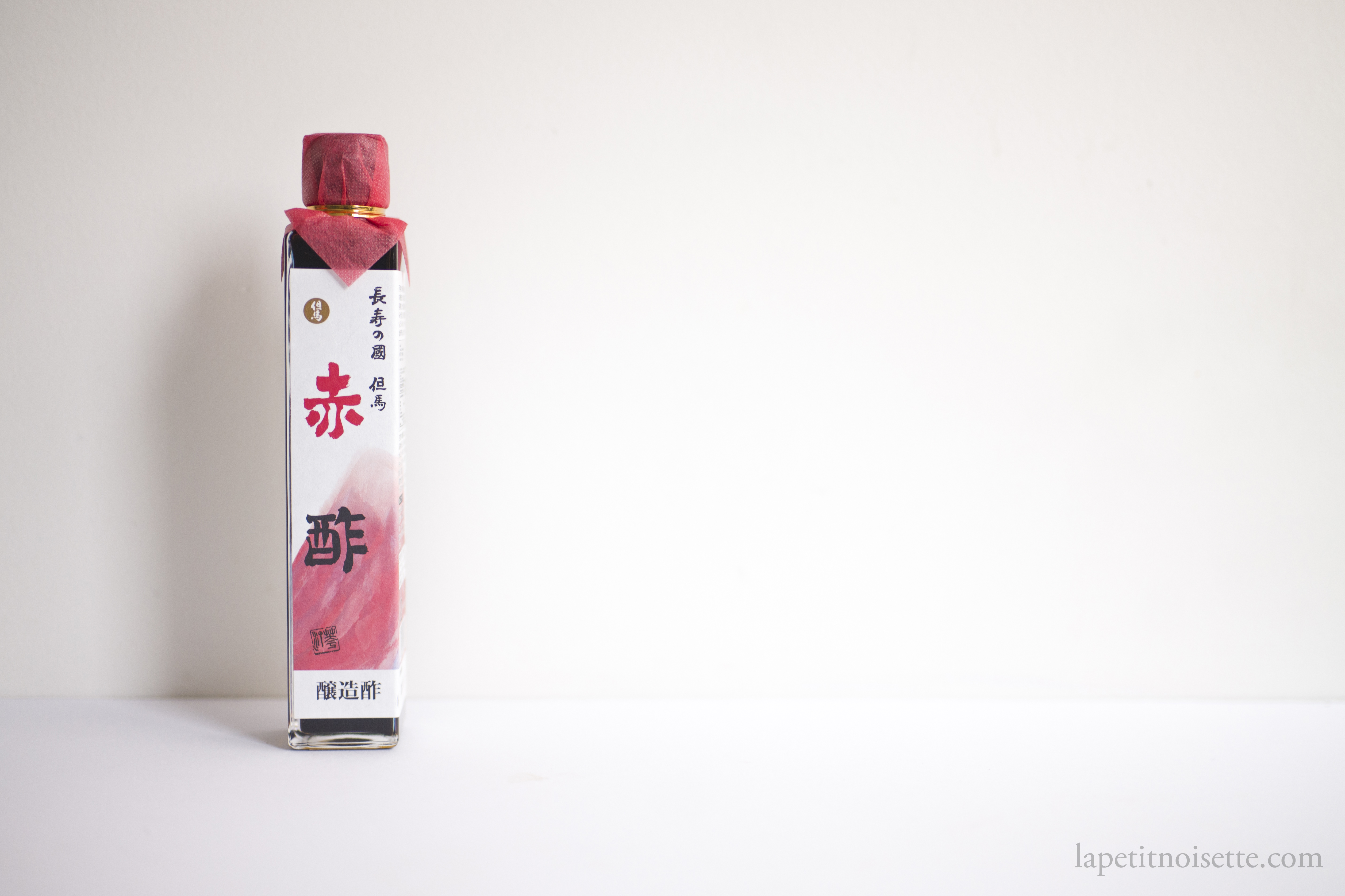 Traditional red sake lees sushi vinegar known as akasu.