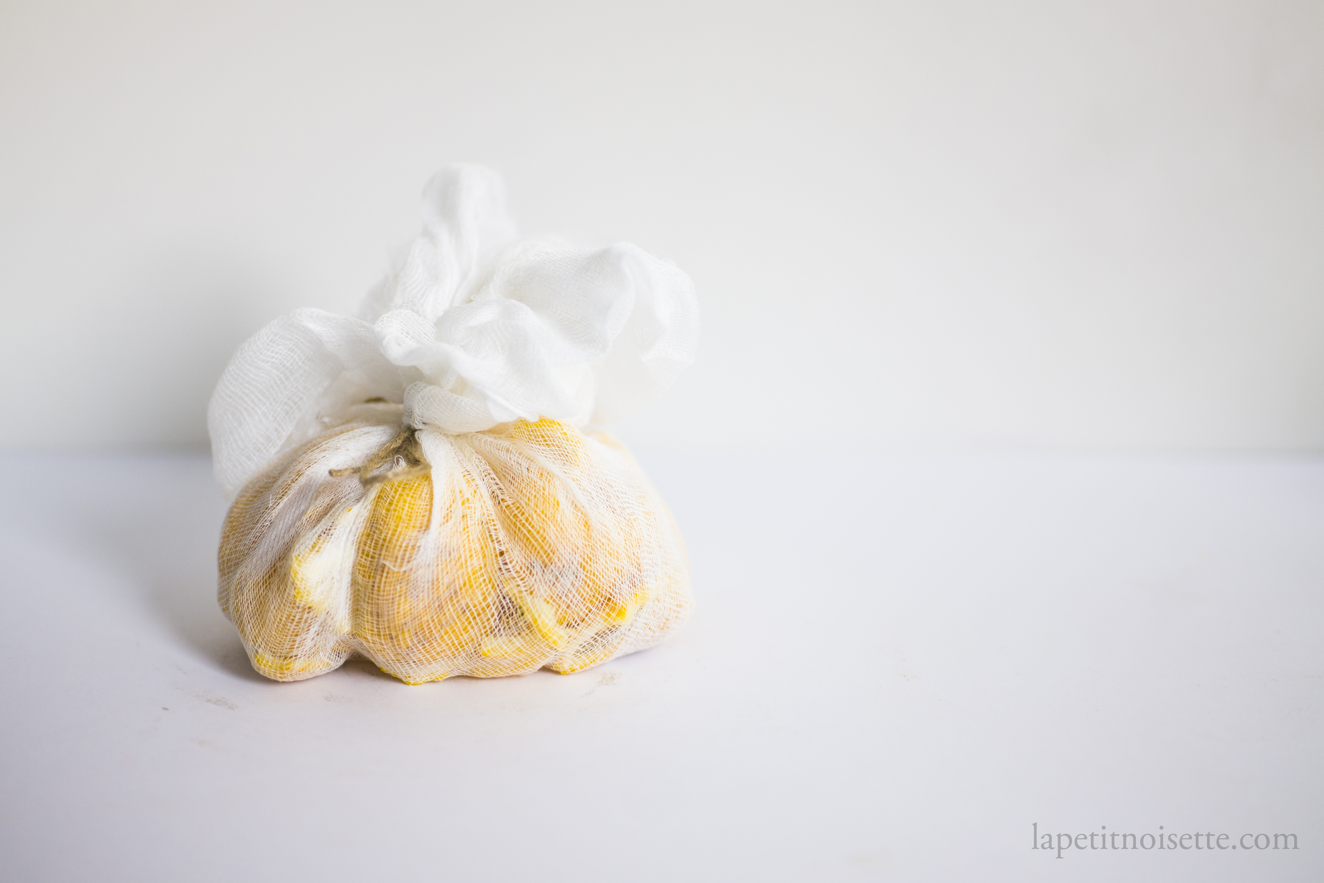 the yuzu peel tied in a muslin cloth bag to make it easier to remove after steeping in alcohol.