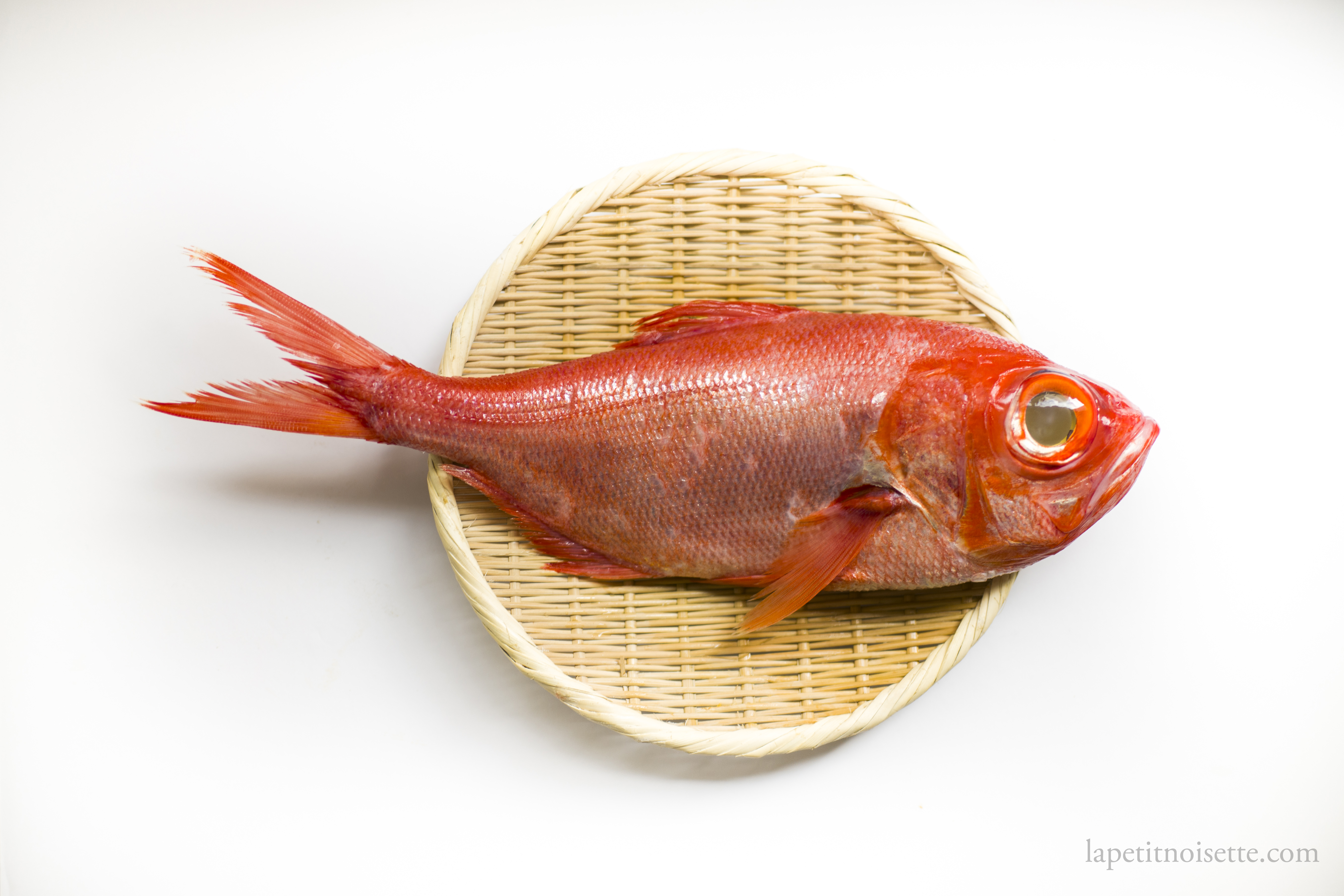 Japanese kinemdai served on a bamboo colander.