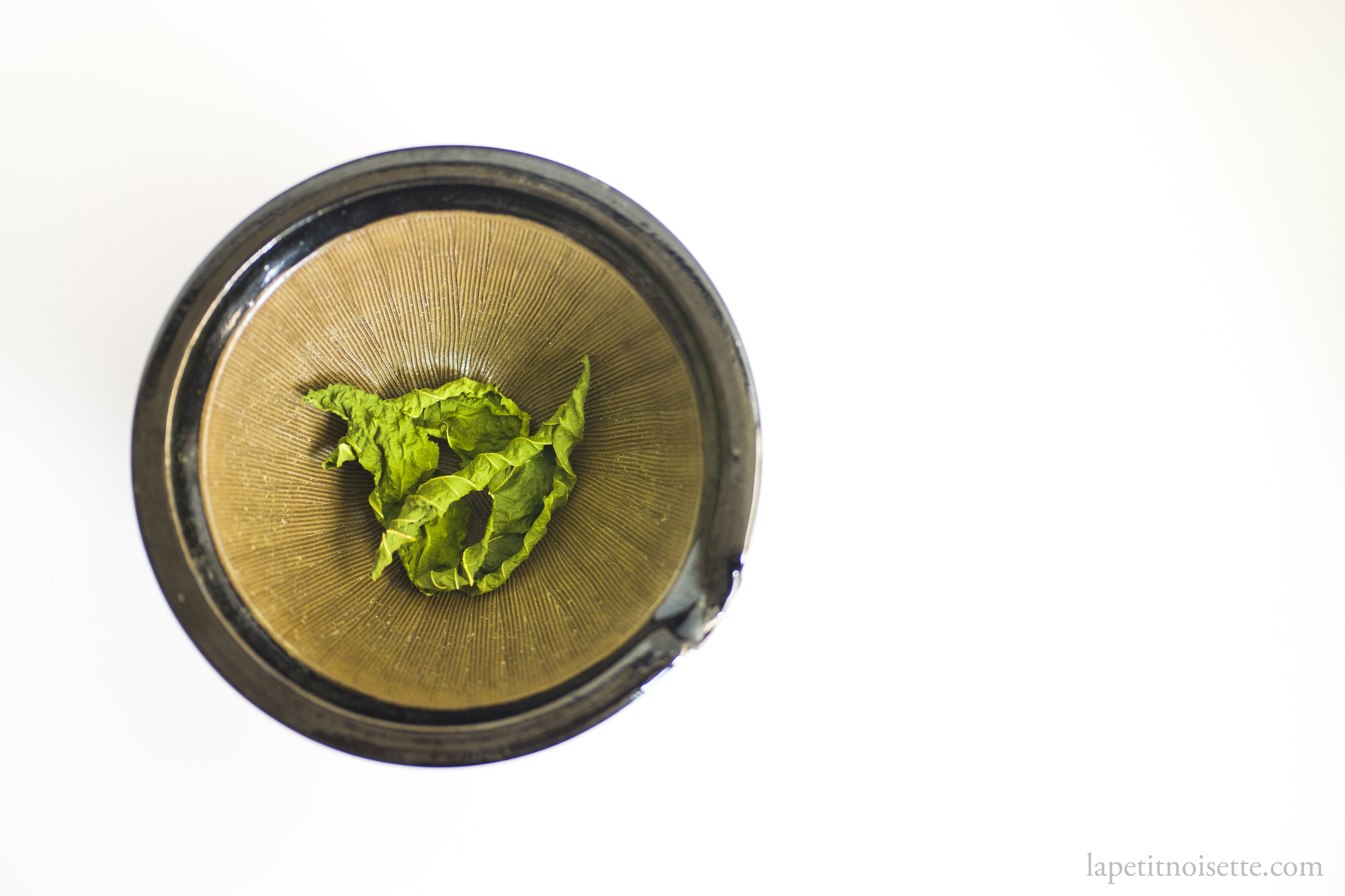 Dried mulberry leaves in a mortar.