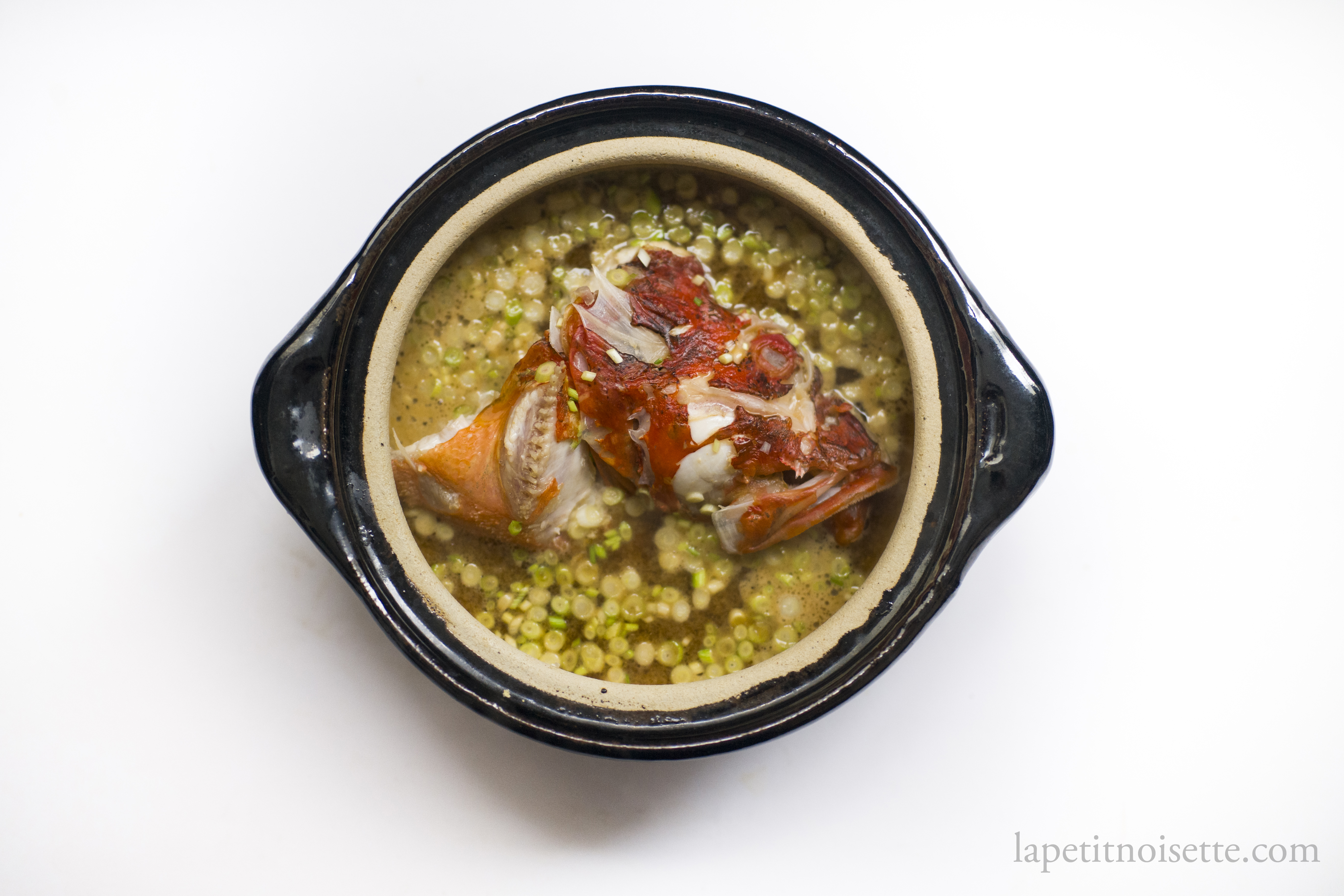 Japanese fish head miso soup in a clay pot.