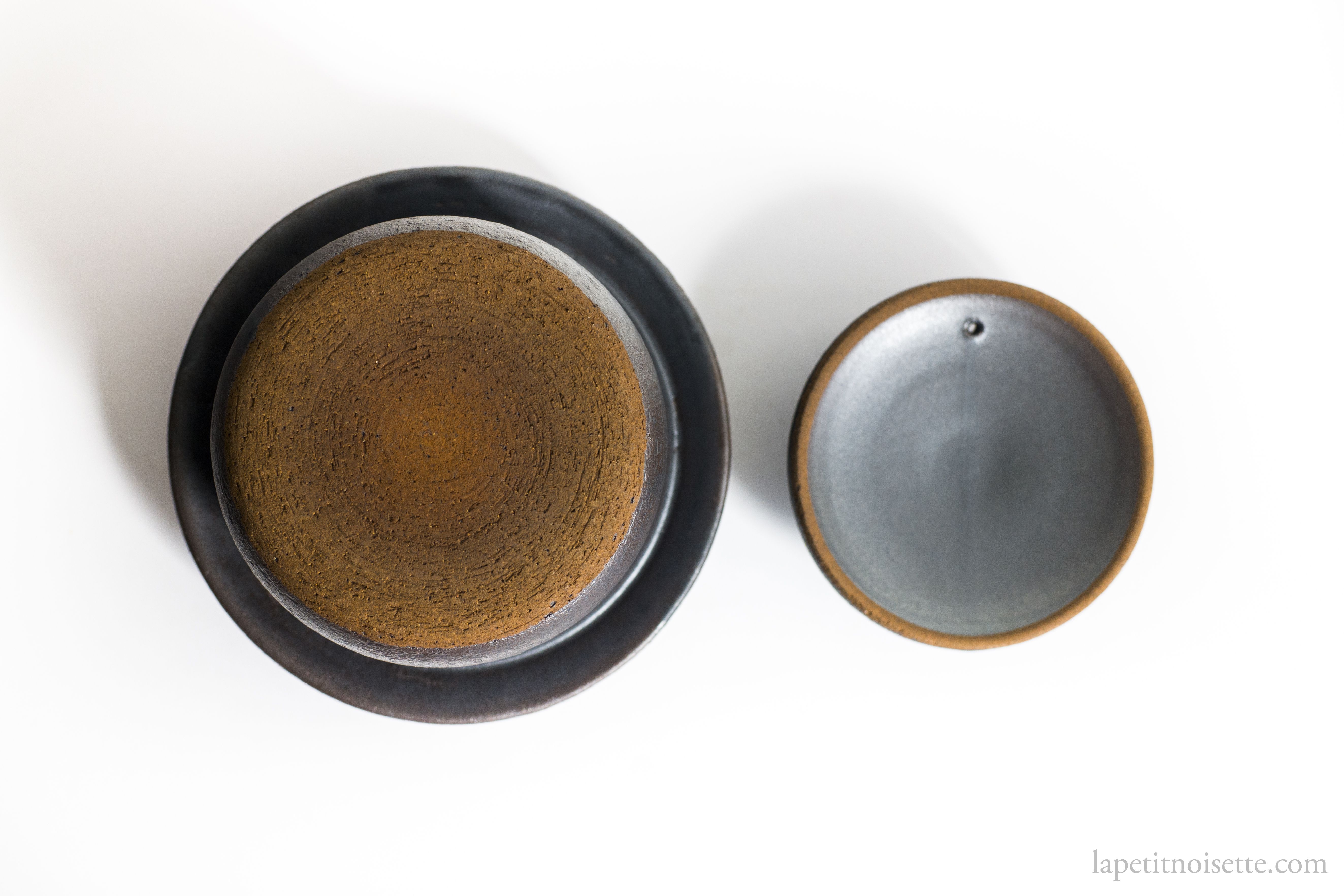 The bottom and underside of Anraku Kiln's clay pot rice cooker.