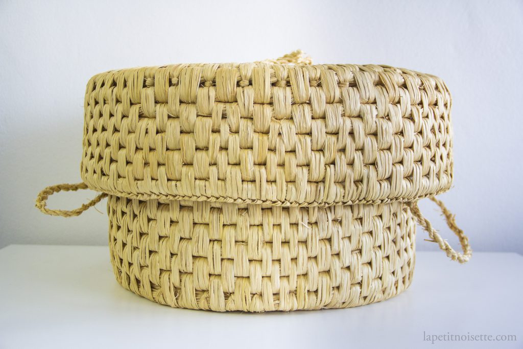 A traditional japanese straw basket know as a warabitsu used to keep rice warm.