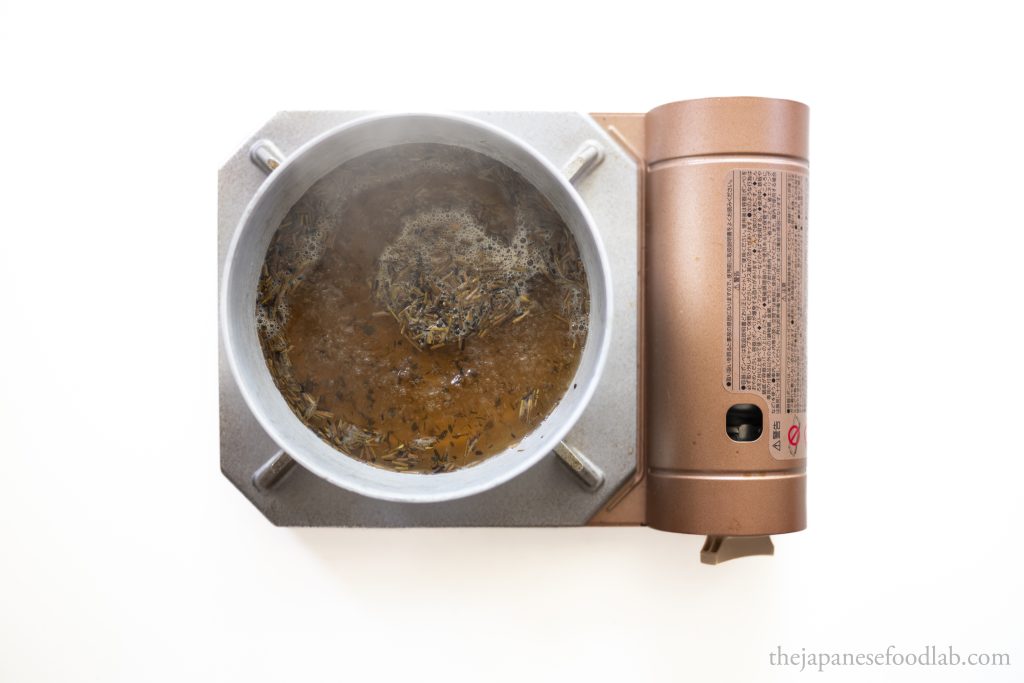 Hojicha tea leaves being boiled to make chadashi for tempura ochazuke. 